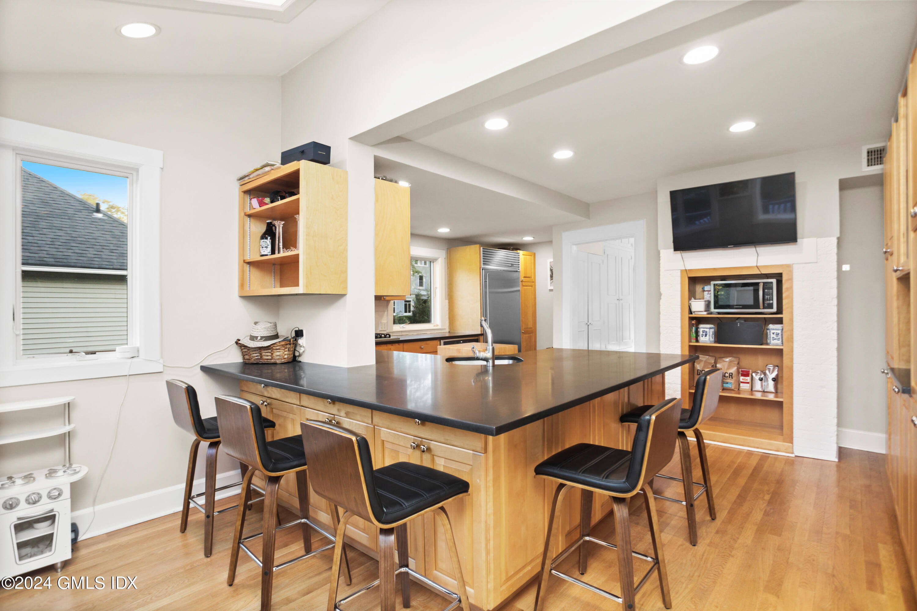 18 Shore Road Old Greenwich, CT 06870 - Photo 9 of 51 a view of a dining room with furniture and wooden floor