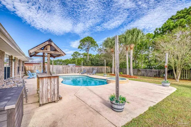 a view of a swimming pool with an outdoor space