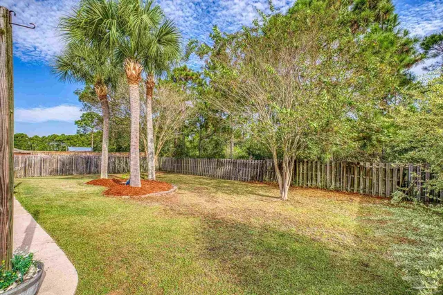 a view of a house with swimming pool and porch