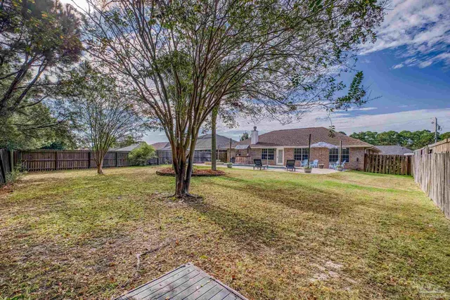 a bedroom with a bed and a book shelf