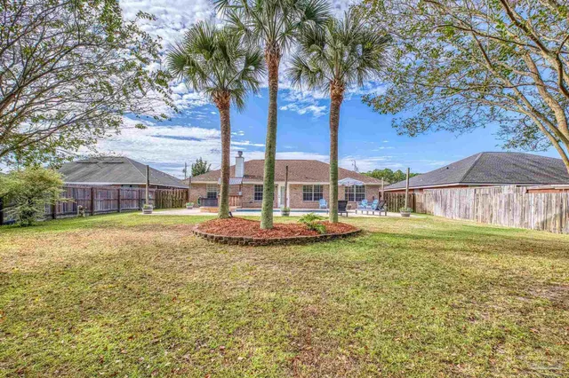 a bedroom with furniture and a flat screen tv