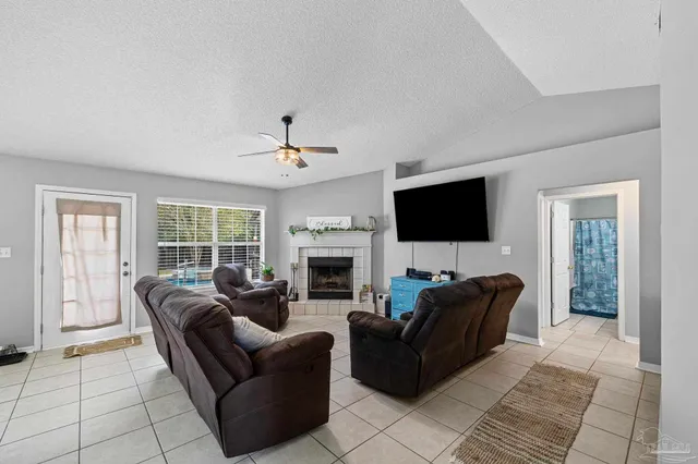 a view of a dining room with furniture and window