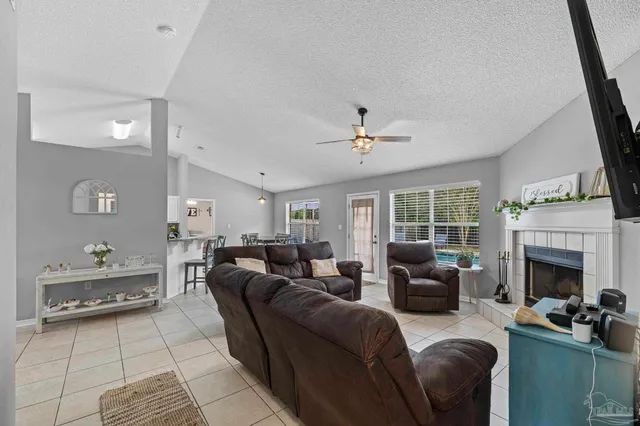 a kitchen with stainless steel appliances a kitchen island a stove a table and chairs