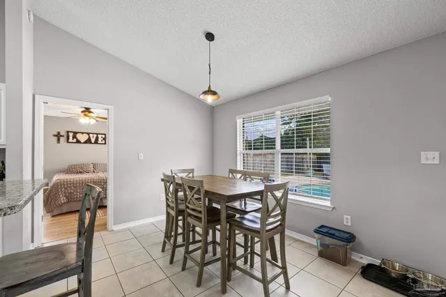 a kitchen with a stove a refrigerator and a refrigerator