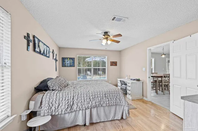 a spacious bathroom with a double vanity sink mirror and bathtub