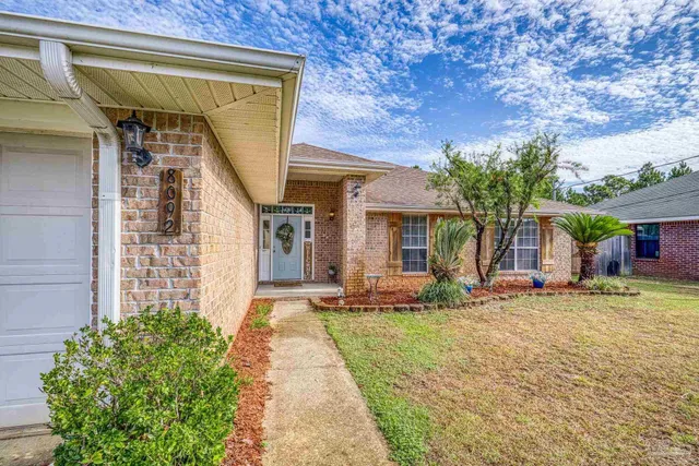 a view of front door of house with potted plant