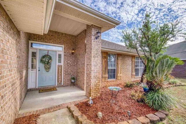a view of a swimming pool with a yard