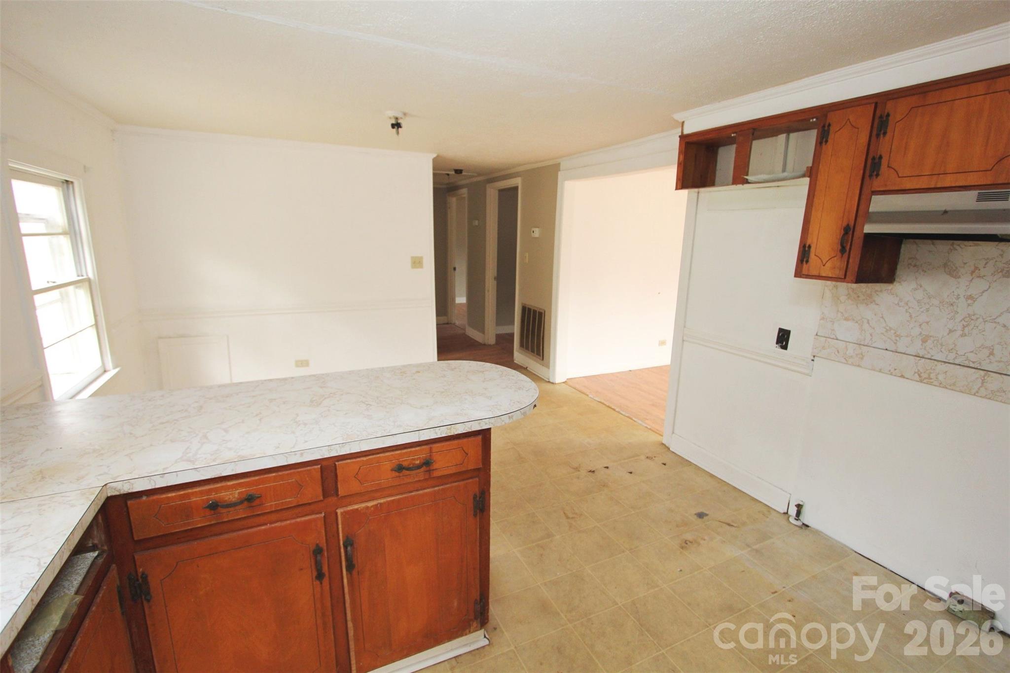 562 Us Highway South Rockingham, NC 28379 - Photo 12 of 42 a kitchen with a sink and a refrigerator