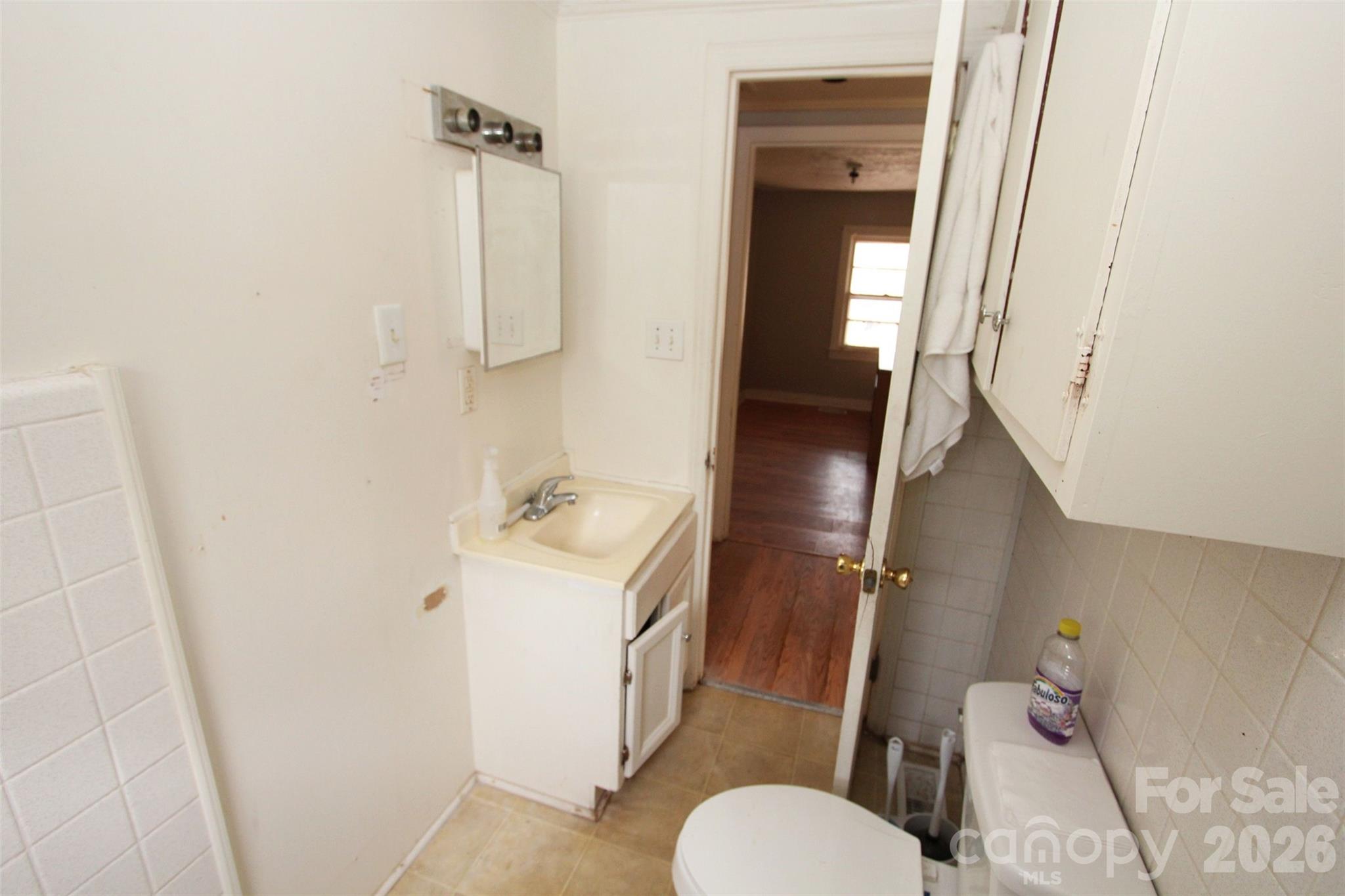562 Us Highway South Rockingham, NC 28379 - Photo 17 of 42 a bathroom with a sink a toilet and shower