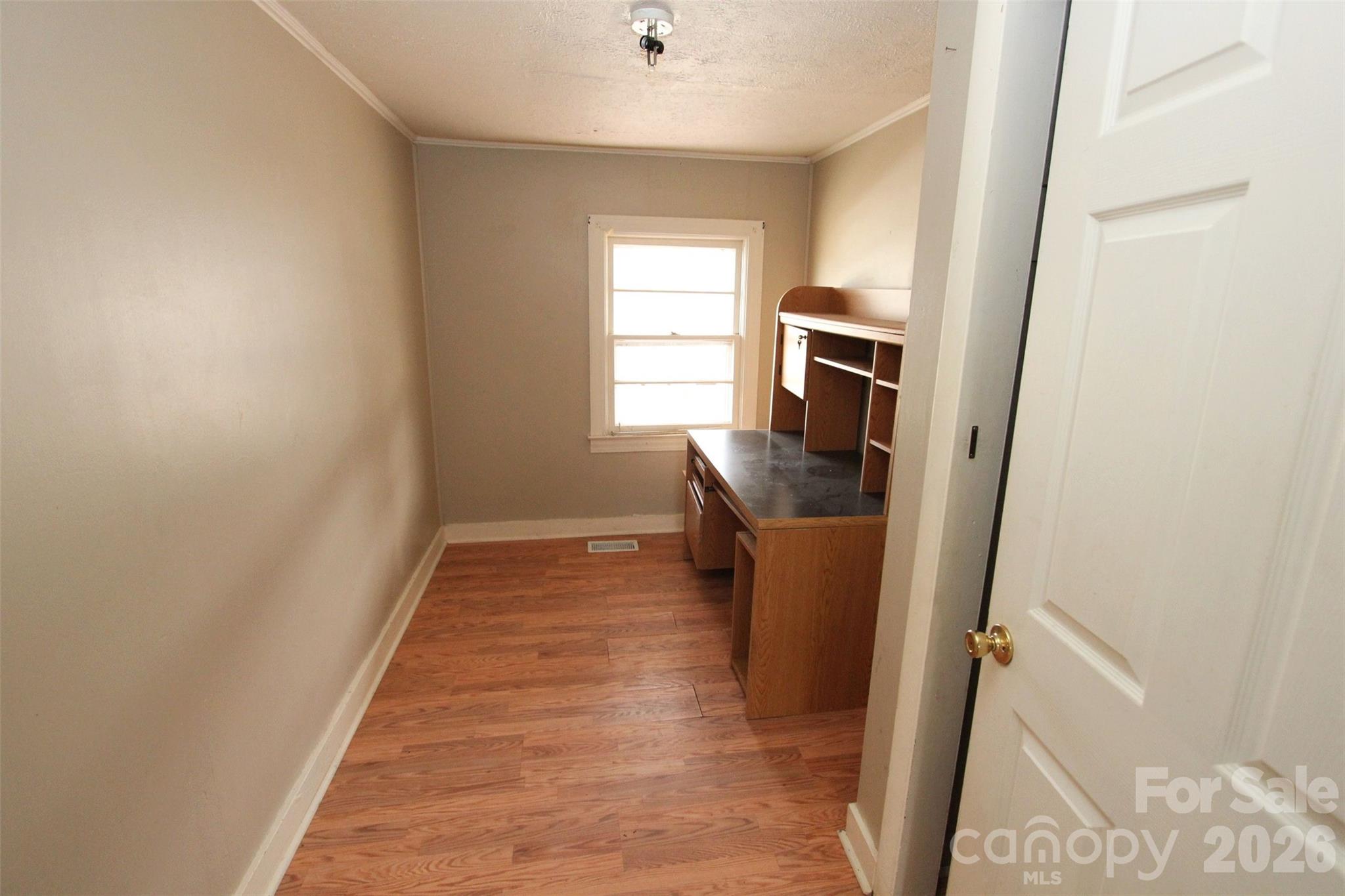 562 Us Highway South Rockingham, NC 28379 - Photo 18 of 42 a walk in closet with wooden floor and a window