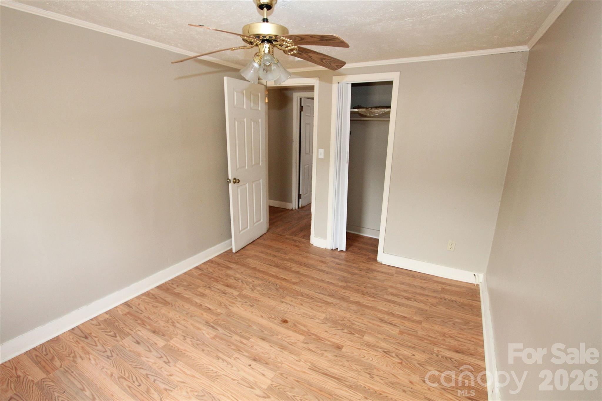 562 Us Highway South Rockingham, NC 28379 - Photo 22 of 42 a view of an empty room with a ceiling fan