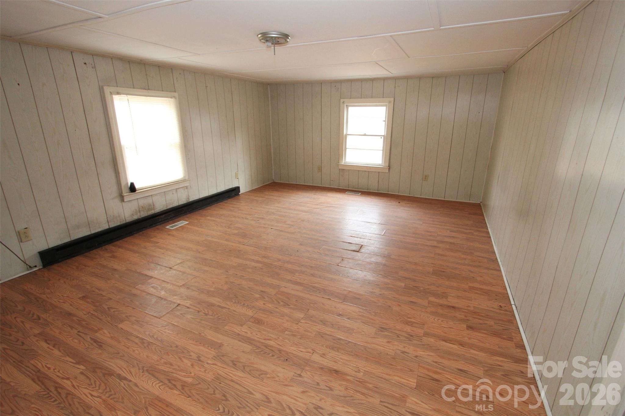 562 Us Highway South Rockingham, NC 28379 - Photo 26 of 42 an empty room with wooden floor and windows