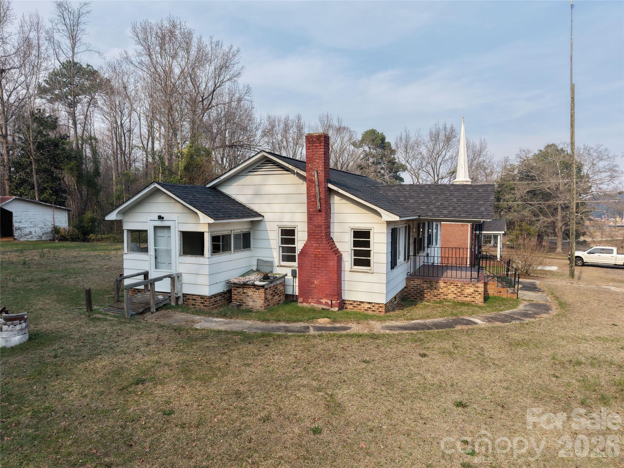 562 Us Highway South Rockingham, NC 28379 - Photo 3 of 42 a view of a house with a yard and large trees