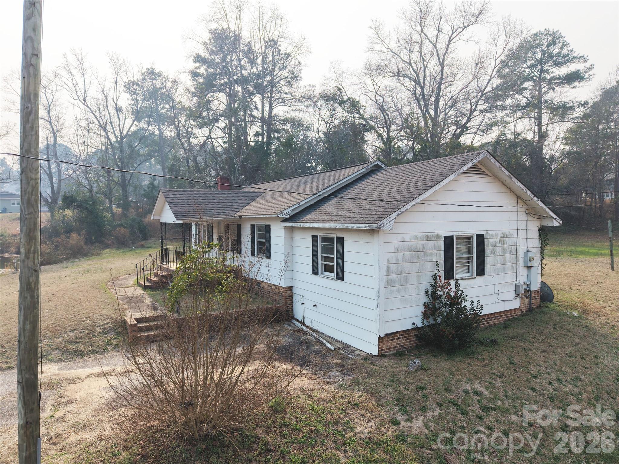 562 Us Highway South Rockingham, NC 28379 - Photo 8 of 42 a front view of a house with garden