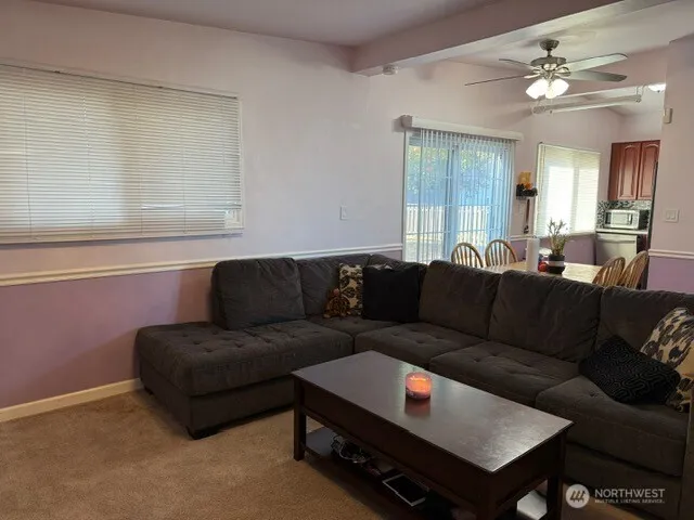 a living room with furniture and a window