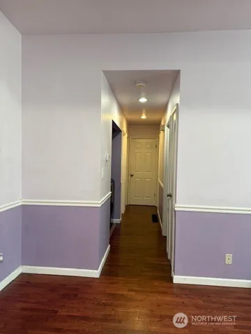 a view of a door and chair in a room