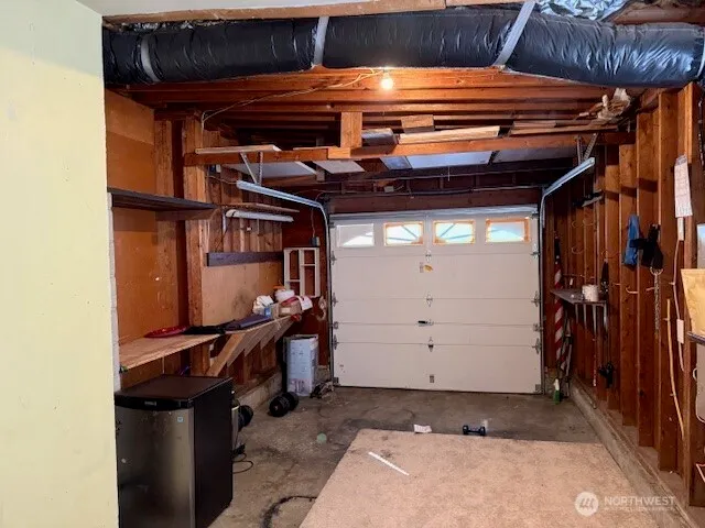 a view of a yard with plants and trees