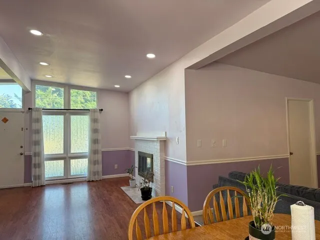 a view of an entryway with wooden floor