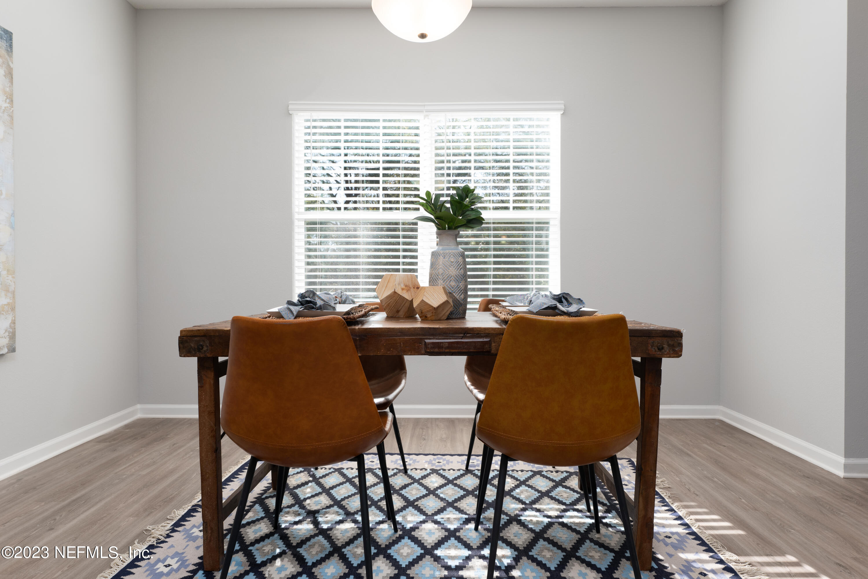 12701 Dunn Creek Road Jacksonville, FL 32226 - Photo 11 of 51 a view of a dining room with furniture and wooden floor
