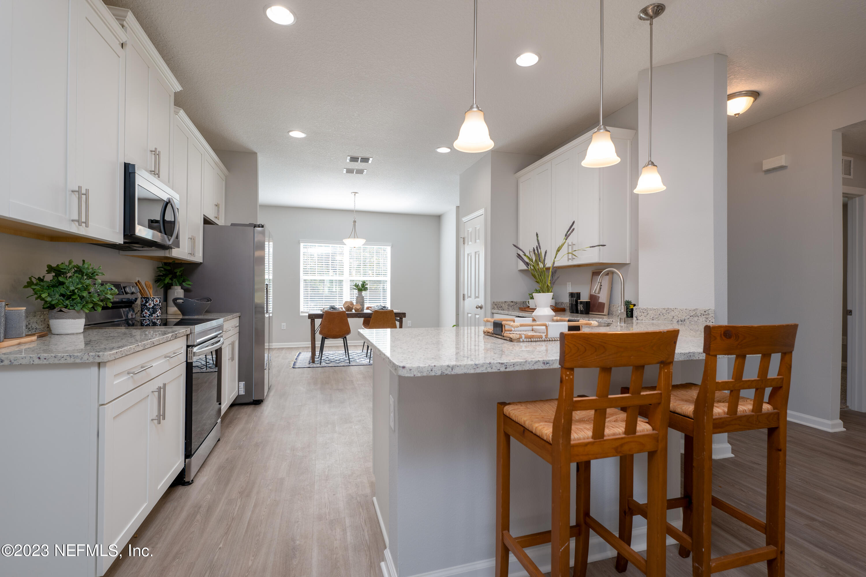 12701 Dunn Creek Road Jacksonville, FL 32226 - Photo 15 of 51 a large kitchen with a table and chairs
