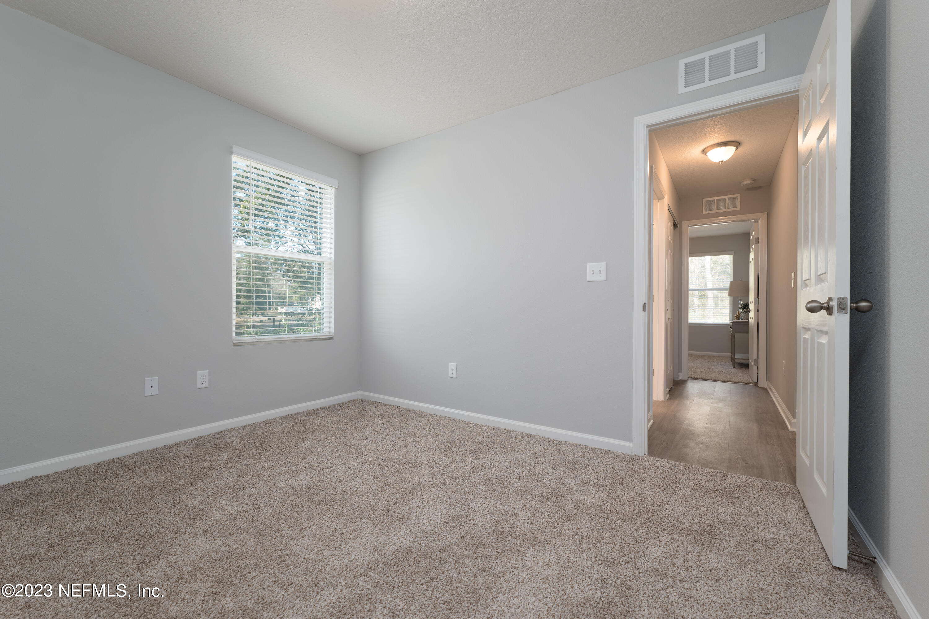 12701 Dunn Creek Road Jacksonville, FL 32226 - Photo 19 of 51 an empty room and windows in a room