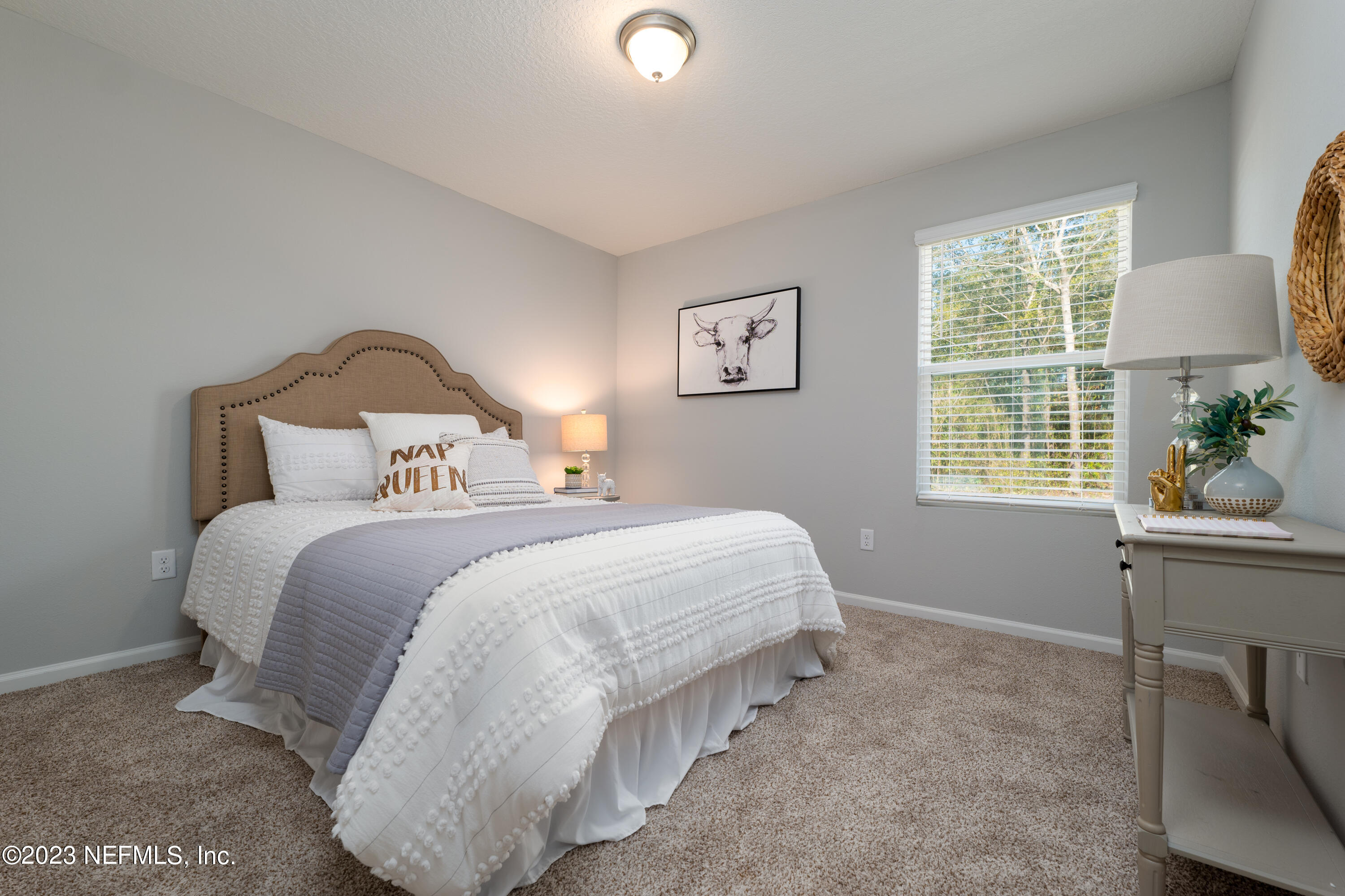 12701 Dunn Creek Road Jacksonville, FL 32226 - Photo 21 of 51 a bedroom with bed and a window