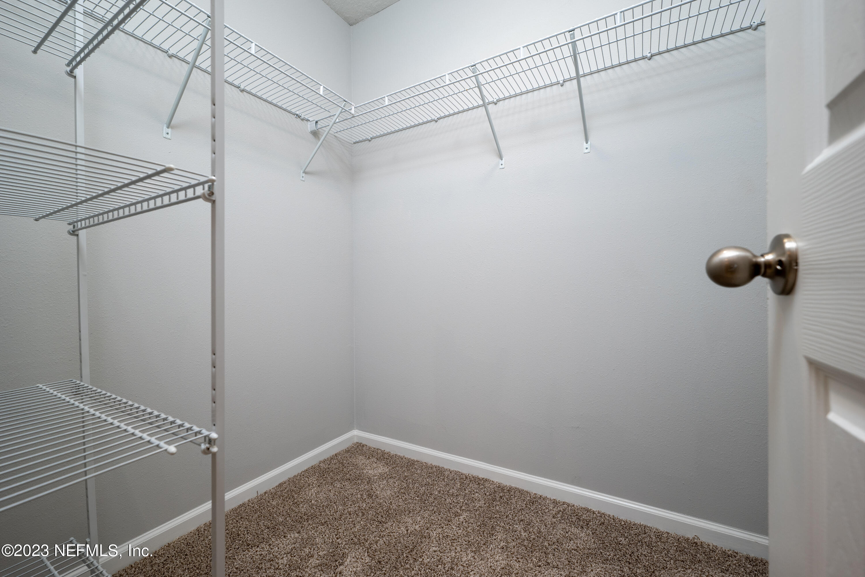 12701 Dunn Creek Road Jacksonville, FL 32226 - Photo 27 of 51 a view of a room with racks on the wall