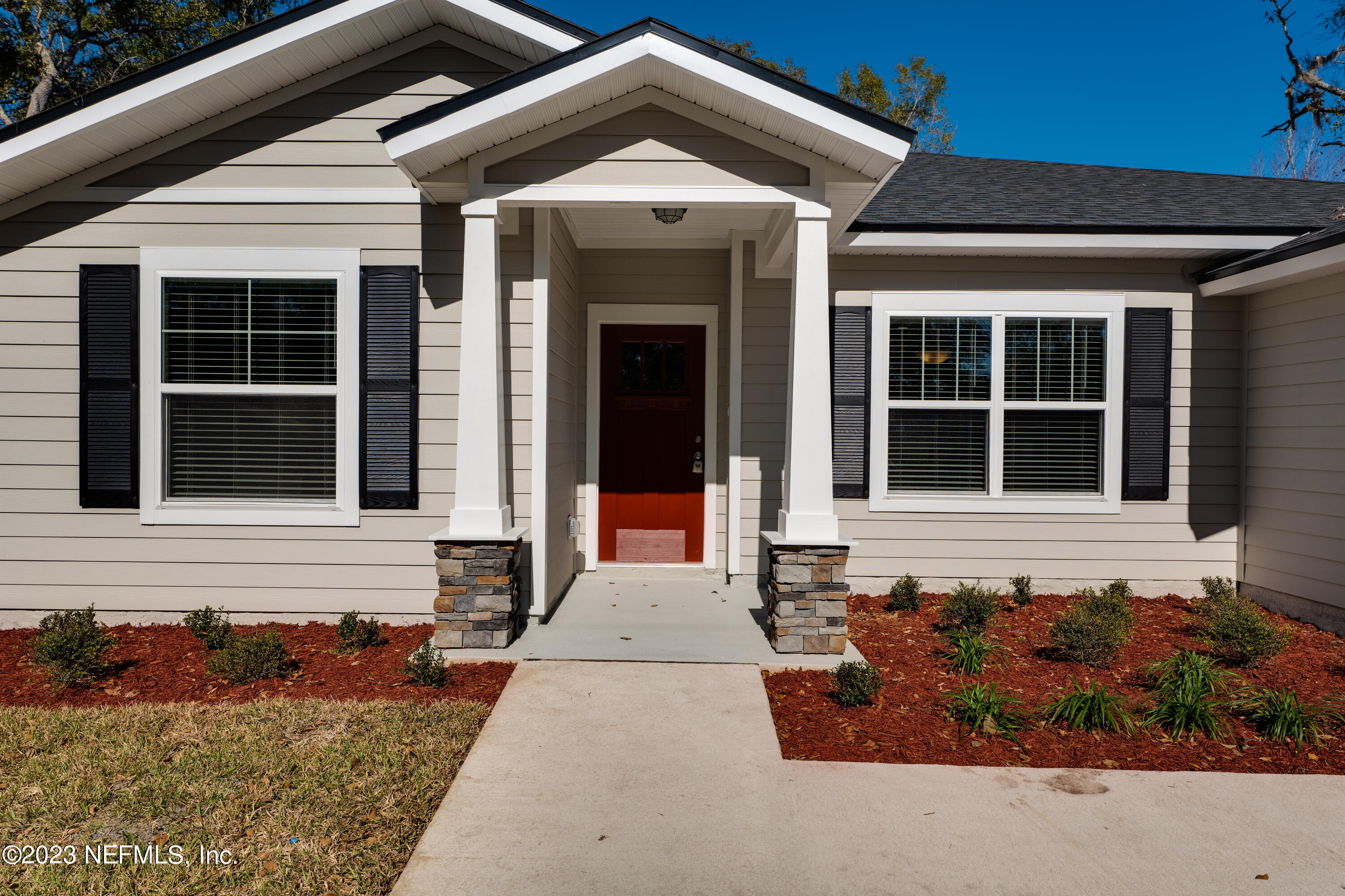 12701 Dunn Creek Road Jacksonville, FL 32226 - Photo 3 of 51 a front view of a house with a yard