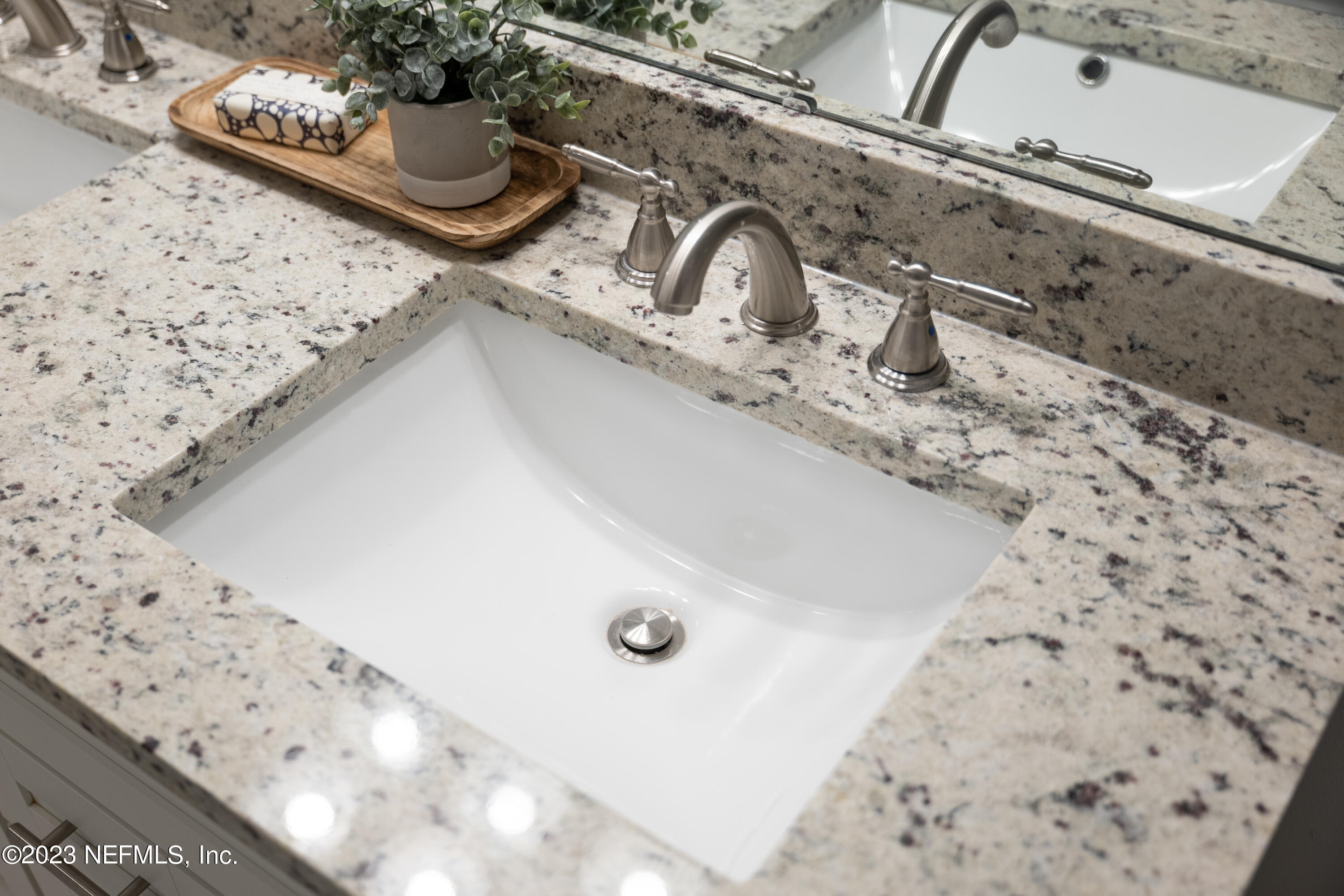 12701 Dunn Creek Road Jacksonville, FL 32226 - Photo 42 of 51 a bathroom with a sink and a mirror