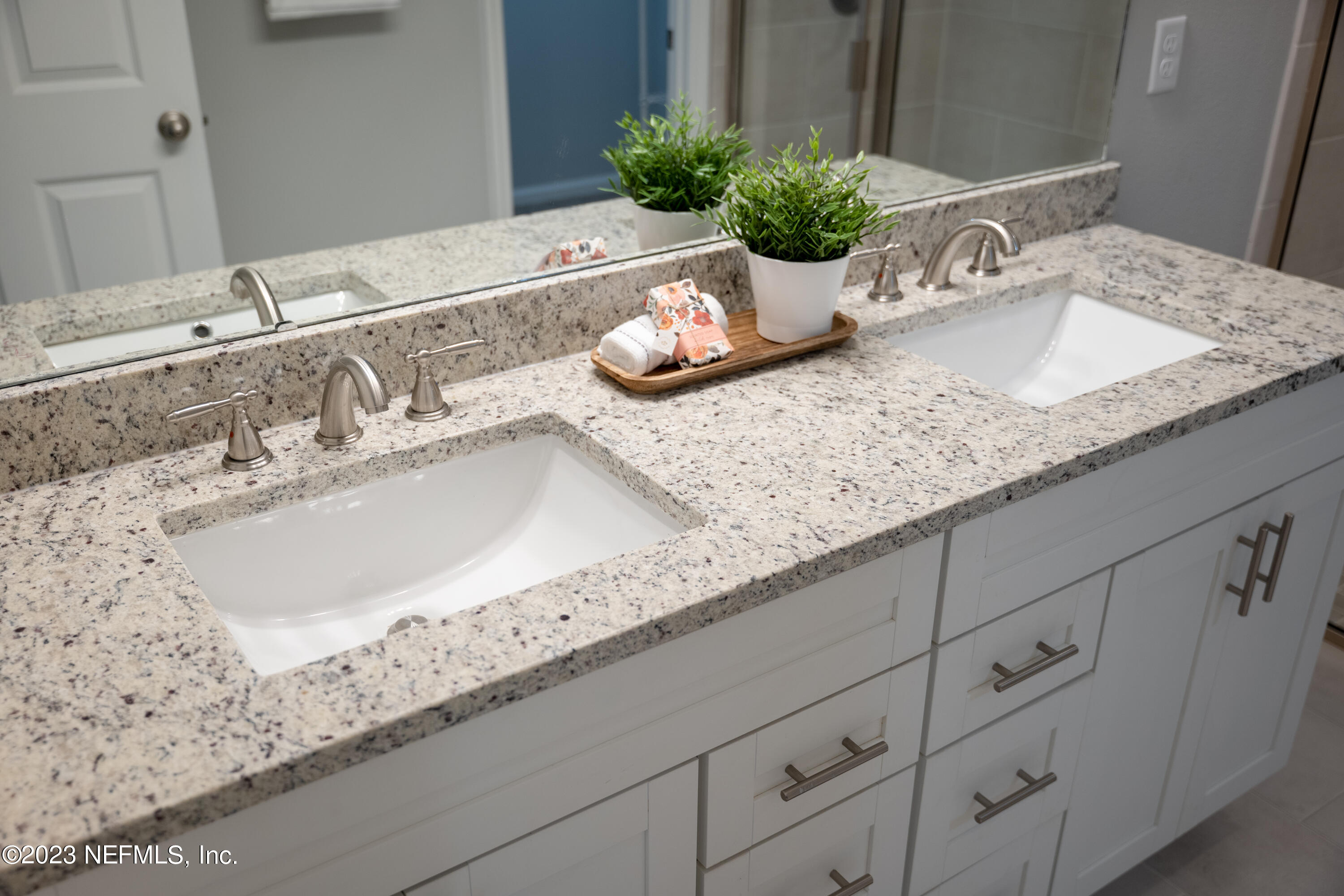 12701 Dunn Creek Road Jacksonville, FL 32226 - Photo 49 of 51 a bathroom with sink and mirror