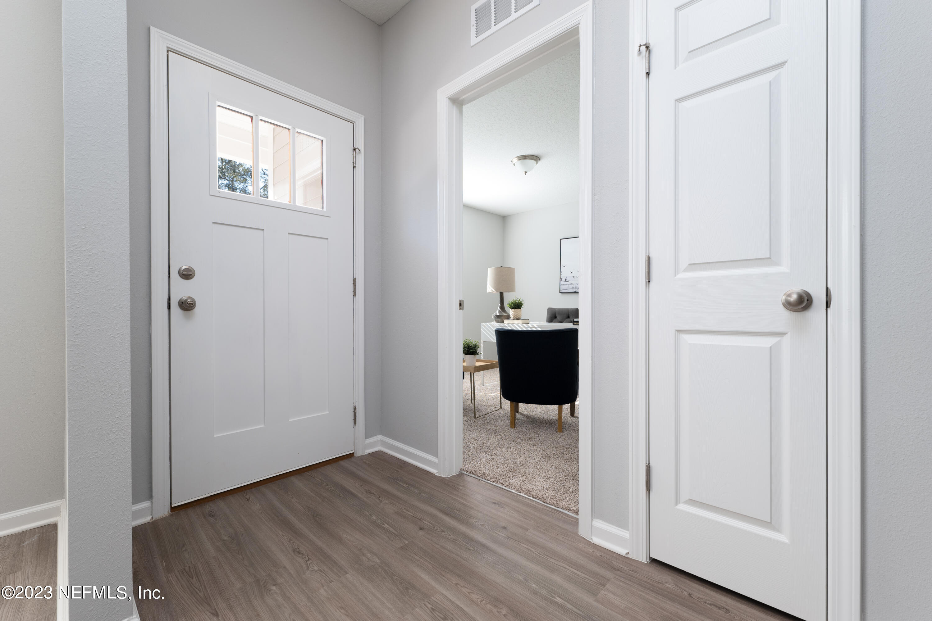 12701 Dunn Creek Road Jacksonville, FL 32226 - Photo 6 of 51 a view of a bathroom from the hallway