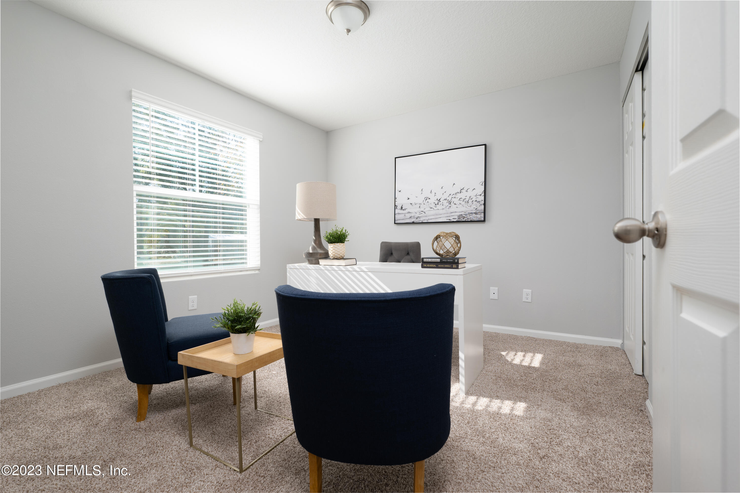 12701 Dunn Creek Road Jacksonville, FL 32226 - Photo 7 of 51 a room with a window and chairs