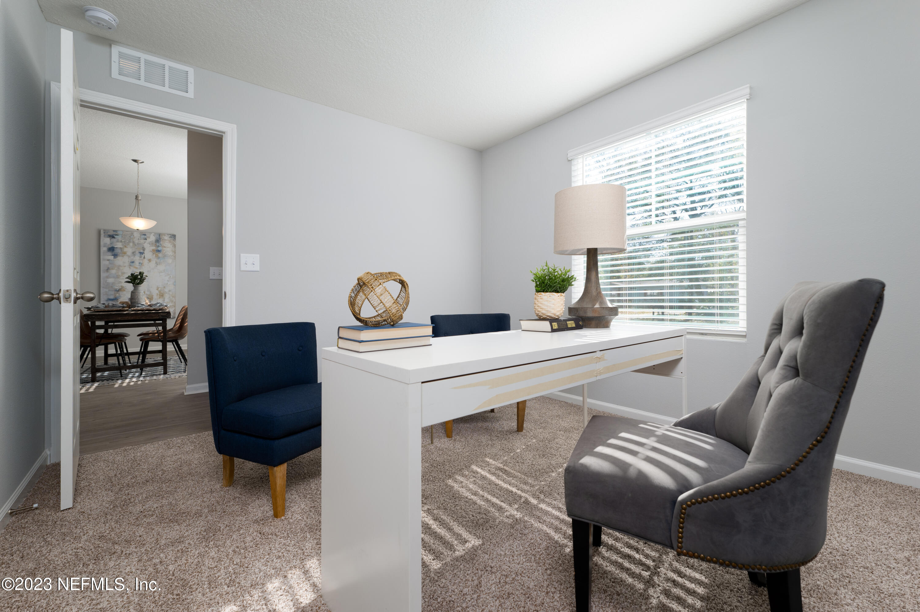 12701 Dunn Creek Road Jacksonville, FL 32226 - Photo 8 of 51 a living room with furniture and wooden floor