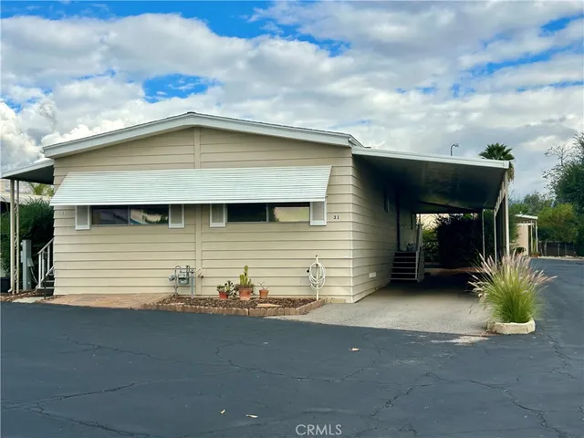 a front view of a house with parking space