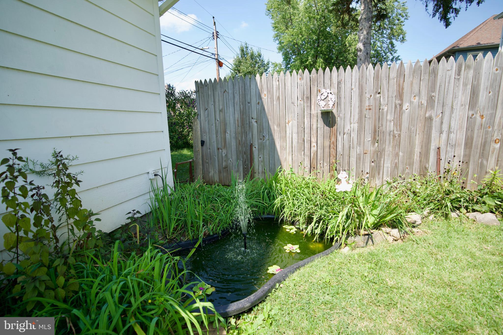 232 Mallow Hill Road Baltimore, MD 21229 - Photo 50 of 63 Garden and pond with fountain