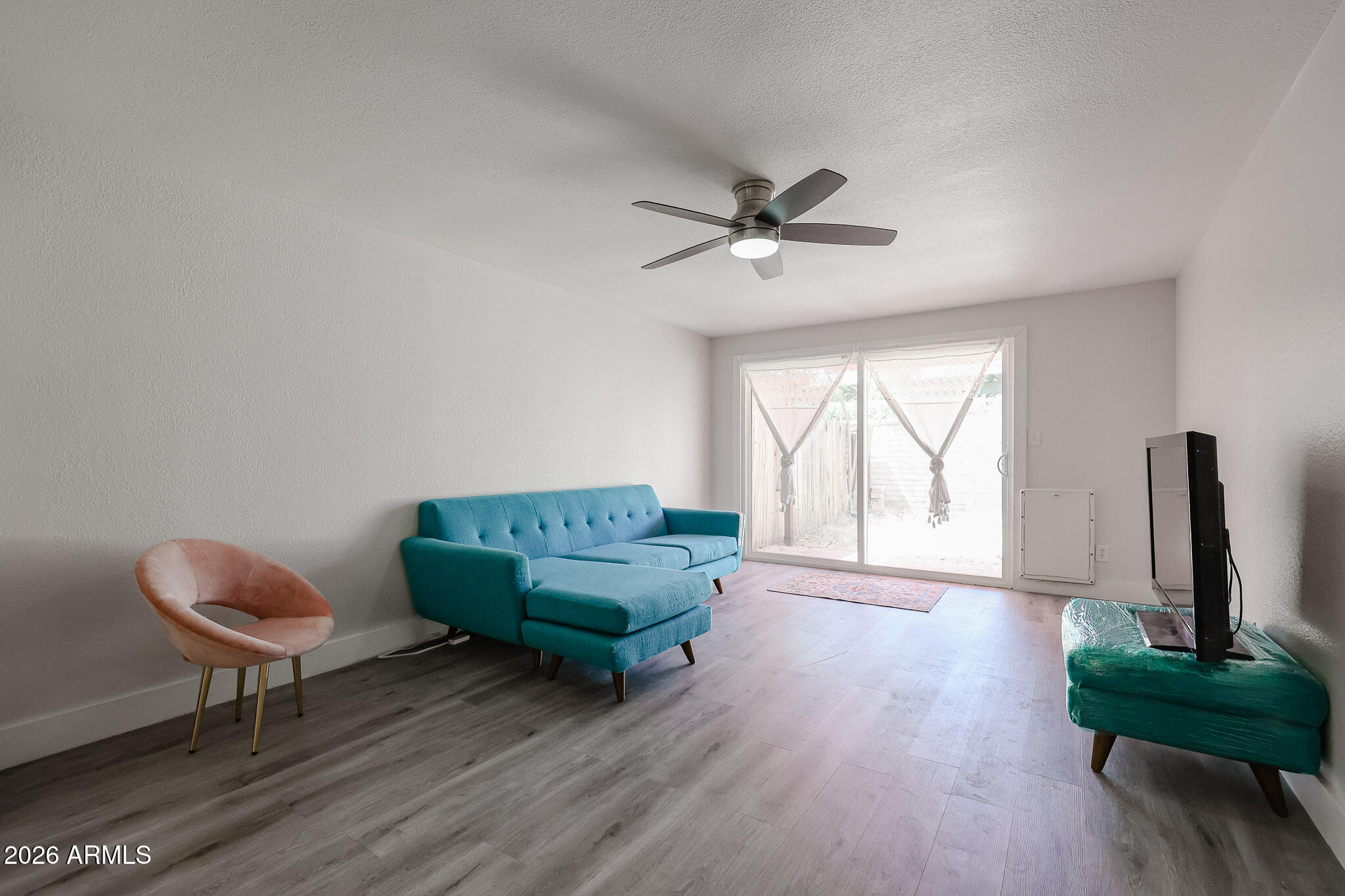 5114 East Monte Vista Road Phoenix, AZ 85008 - Photo 39 of 45 a living room with furniture and a window