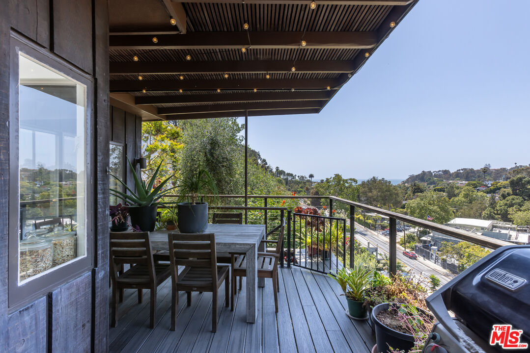454 Stassi Lane Santa Monica, CA 90402 - Photo 11 of 33 a view of a balcony with chairs and wooden floor