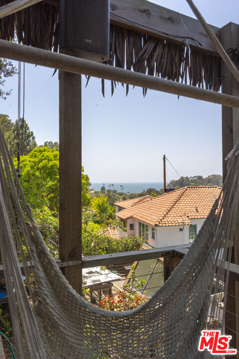 454 Stassi Lane Santa Monica, CA 90402 - Photo 23 of 33 a view of a balcony with wooden floor and a potted plant