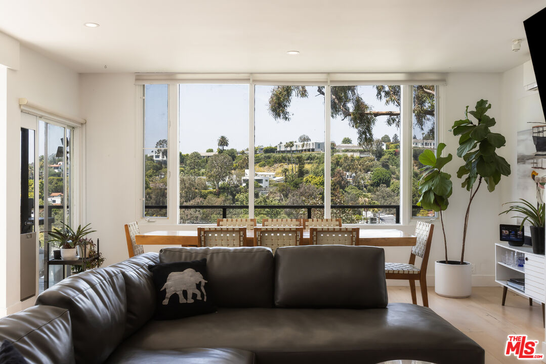 454 Stassi Lane Santa Monica, CA 90402 - Photo 9 of 33 a living room with furniture and a large window