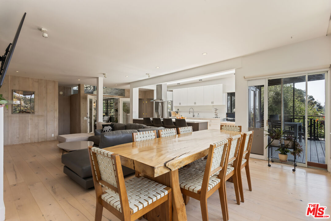 454 Stassi Lane Santa Monica, CA 90402 - Photo 10 of 33 a view of a dining room with furniture and wooden floor