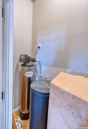 a view of a kitchen with a stove and a refrigerator