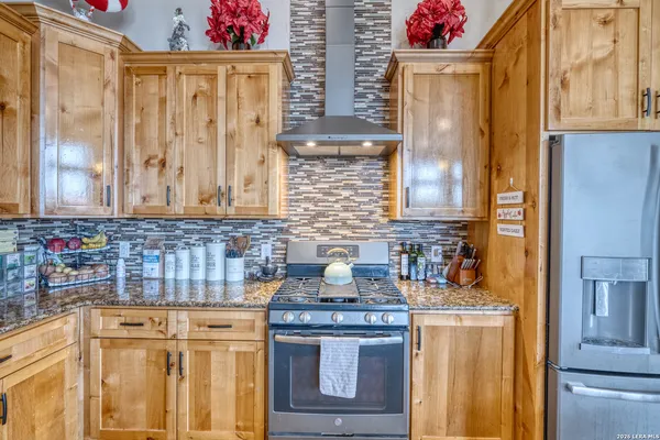 a bathroom with a granite countertop sink a window and a mirror