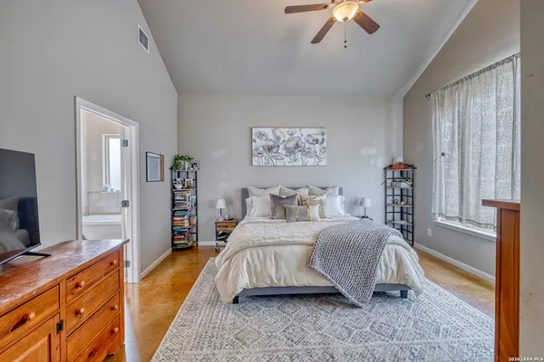 a bedroom with a bed and a dresser