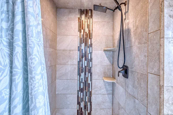 a bathroom with a sink and a window