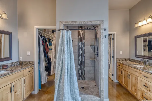 a bedroom with a bed and cabinets