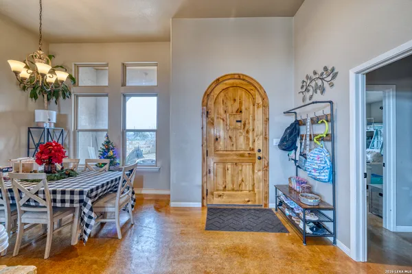 a view of a backyard with sitting area