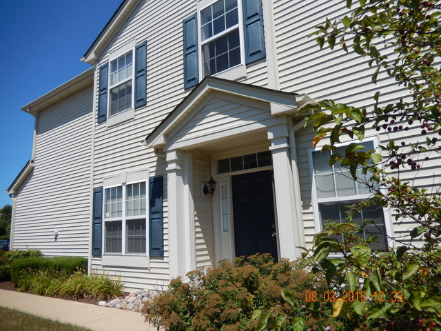 3948 Pratt Street Plano, IL 60545 - Photo 18 of 19 a view of a house with potted plants