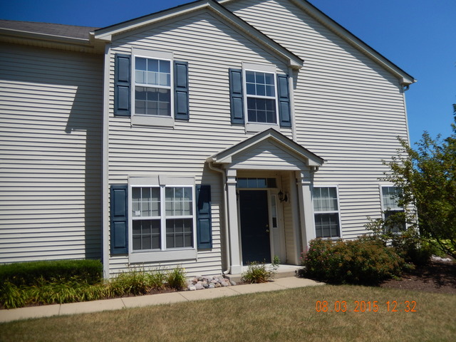 3948 Pratt Street Plano, IL 60545 - Photo 19 of 19 a front view of a house with garden
