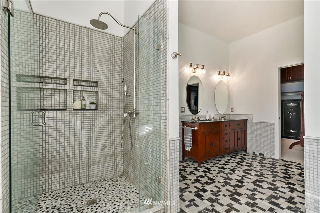 4458 Preston-Fall City Road Southeast Fall City, WA 98024 - Photo 16 of 40 a bathroom with a sink a mirror and shower