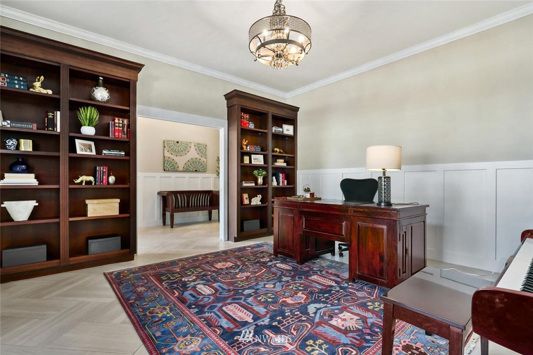 4458 Preston-Fall City Road Southeast Fall City, WA 98024 - Photo 20 of 40 a living room with furniture a rug and a bookshelf